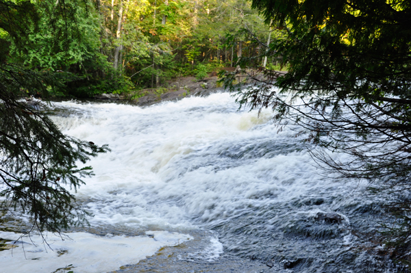 the falls curving over a flat area